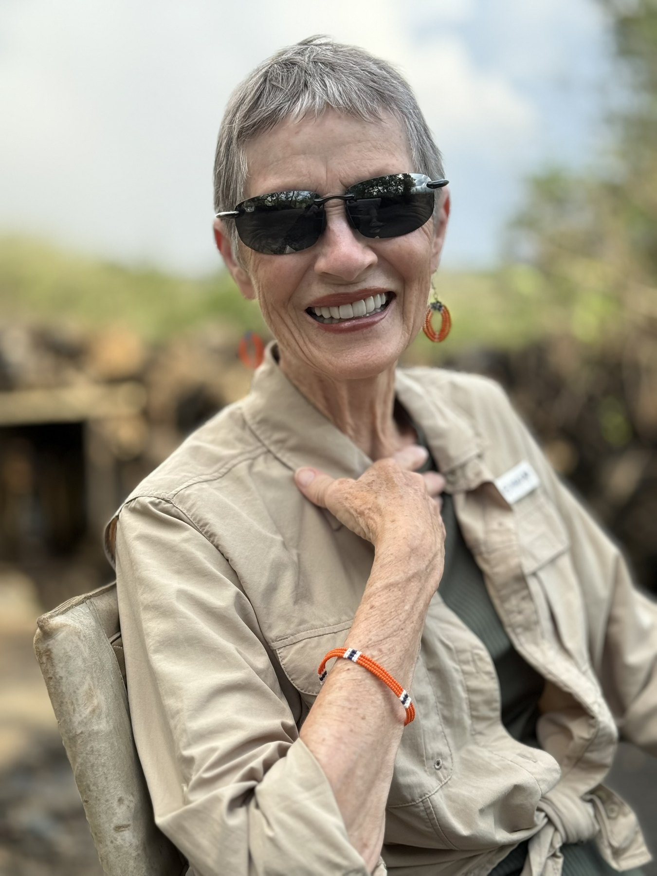 JP smiling outdoors at Campi Ya Kanzi