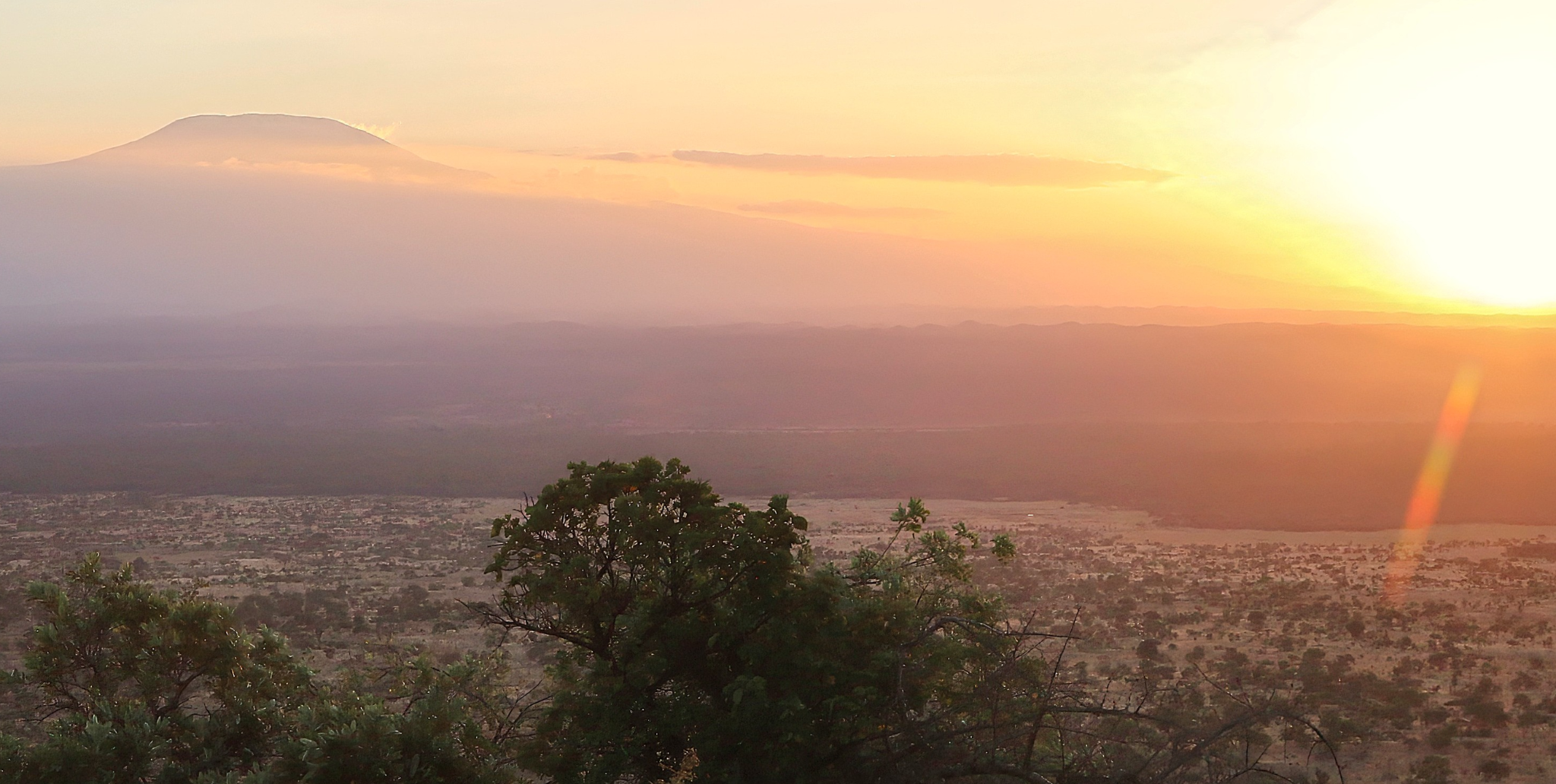 Mount Kilimanjaro at sunset seen across an overlook in Kenya